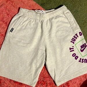 Men's brand new without tags Nike shorts, size medium color is oatmeal.